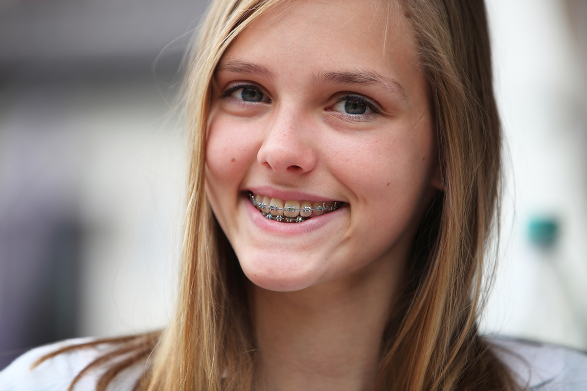 Teen Girl Smiling with Metal Braces