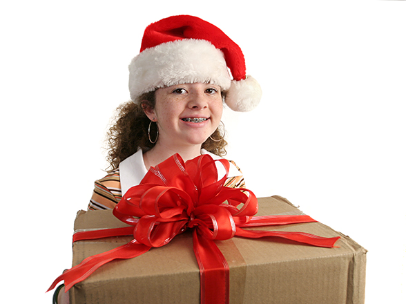 Girl with braces and holiday food for kids with braces