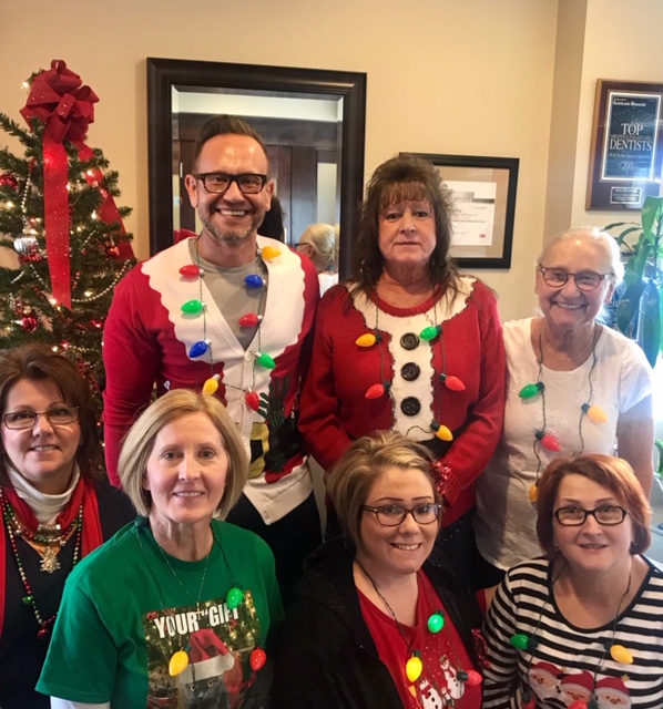 Dr. Andrew W. Skorobatckyj and his team dressed for Christmas