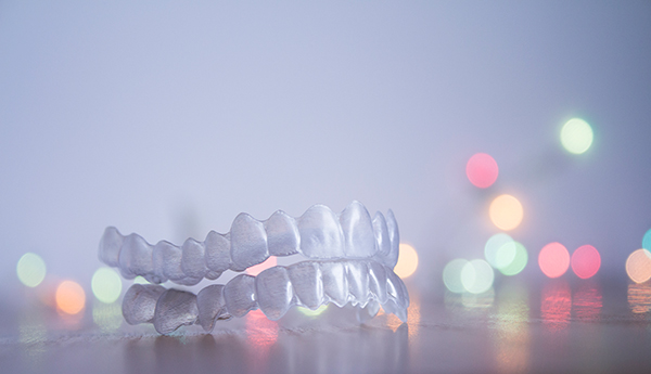 Invisalign retainers sitting on a table.