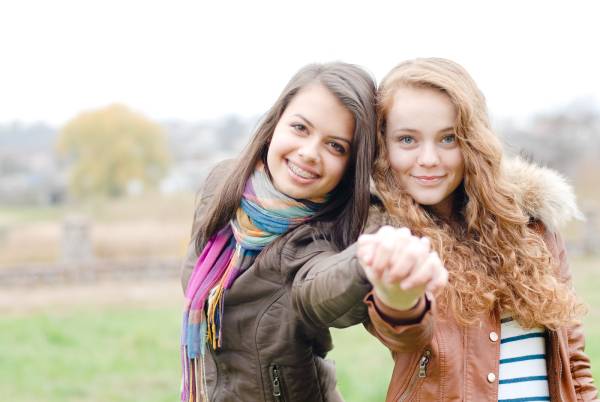 Two young girls with one wearing braces