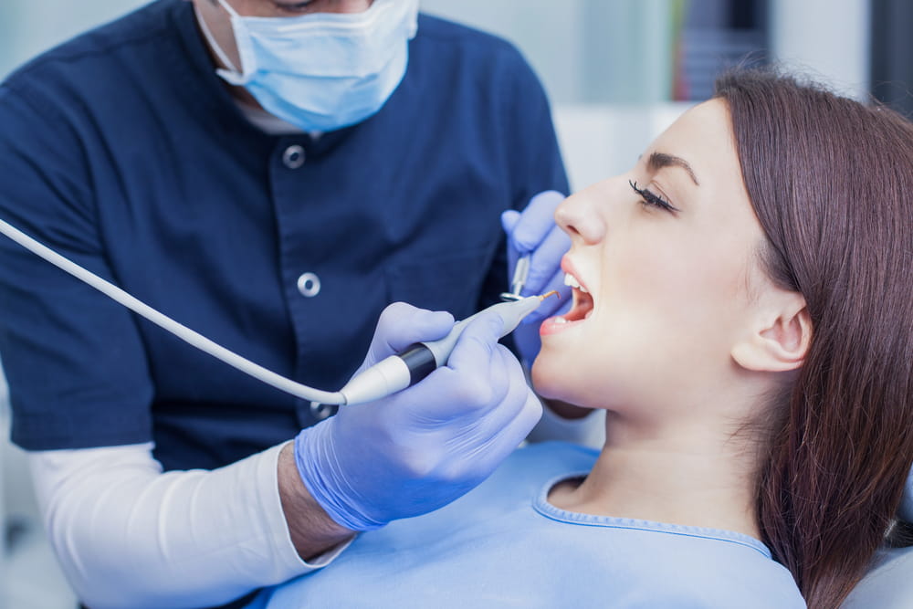 Woman having her teeth cleaned