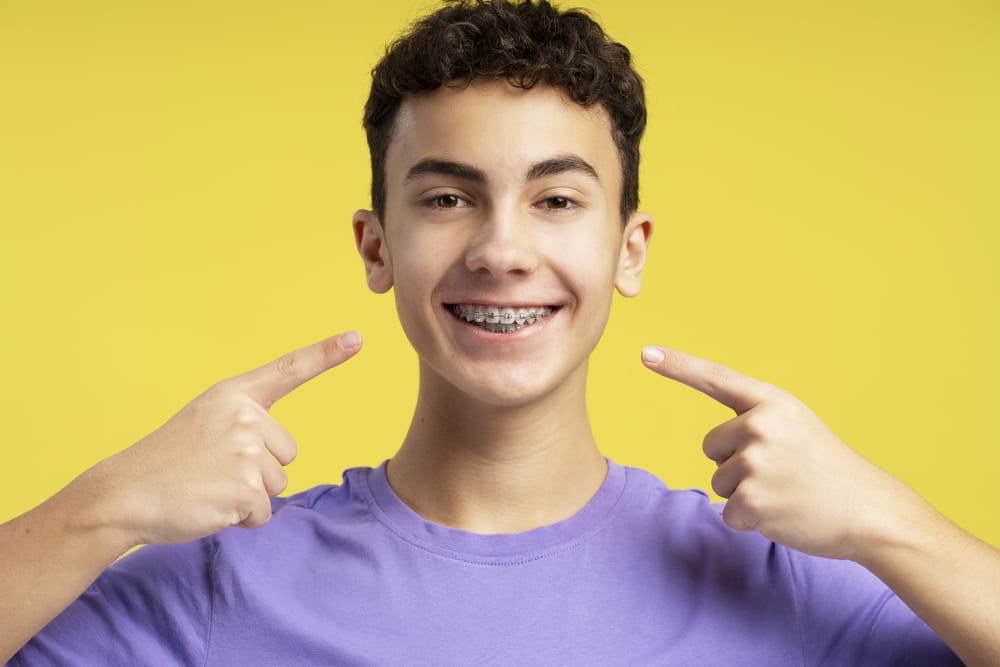 A smiling teenager with braces